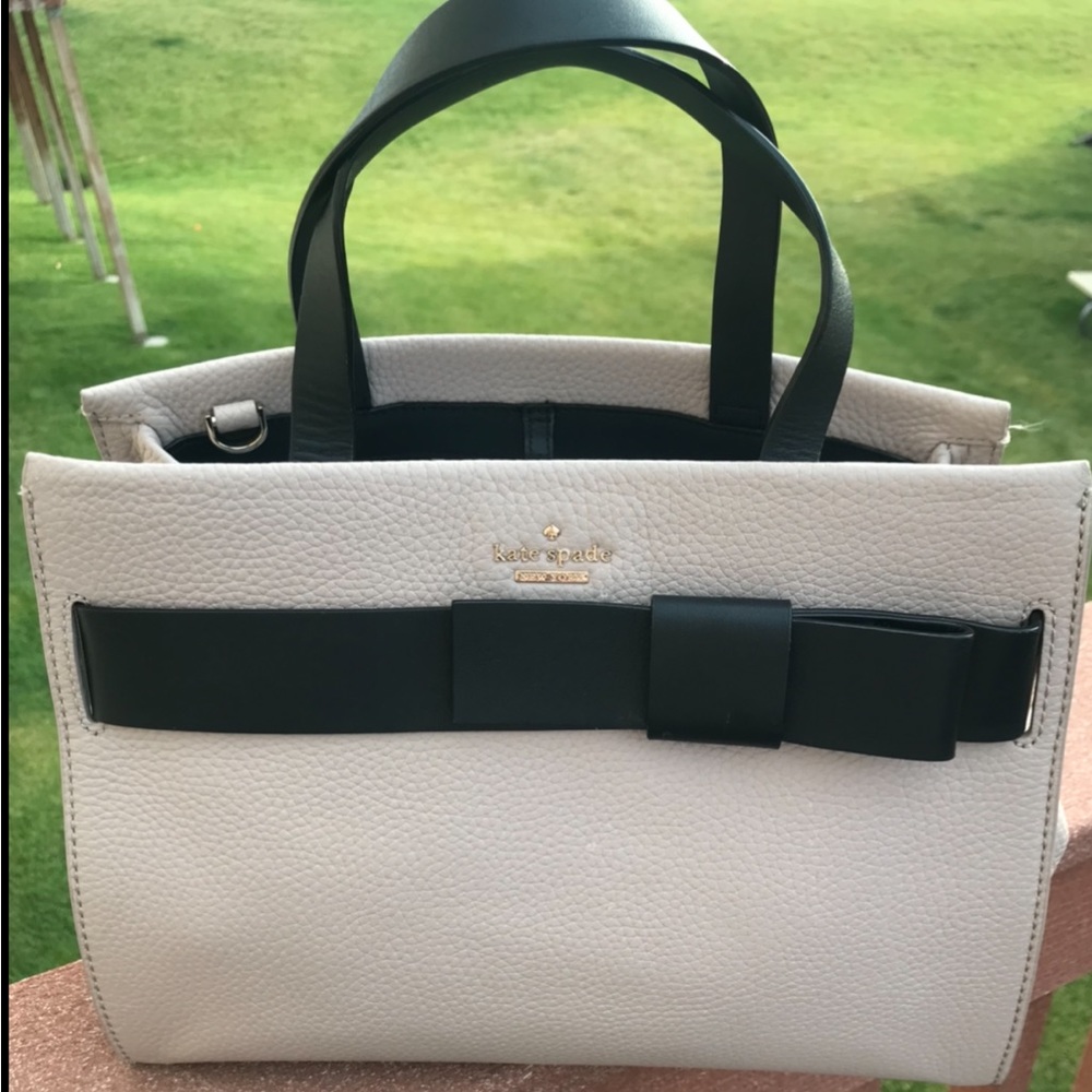 Kate Spade taupe leather bag w/black bow. 12.5” wide x 9.5” tall